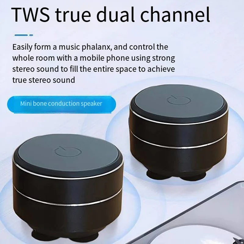 Two black TWS true dual channel speakers with text on a white background
