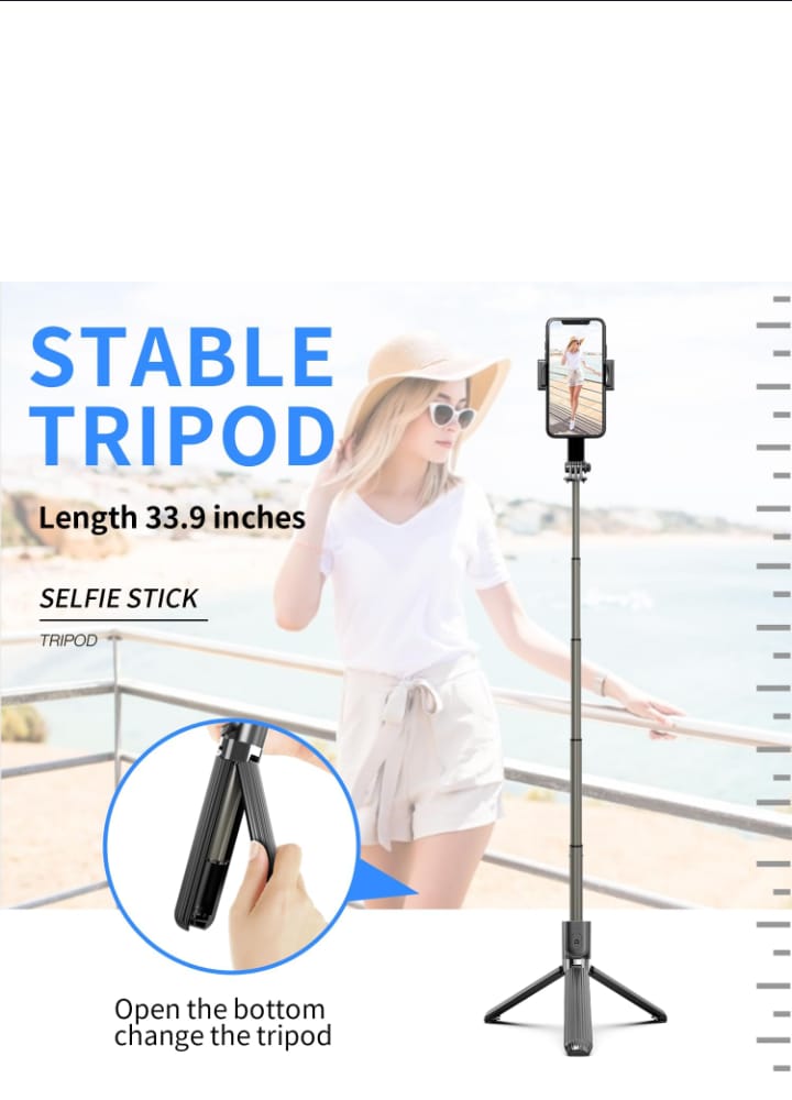 Stable tripod with selfie stick feature, shown in use by a person on a balcony.