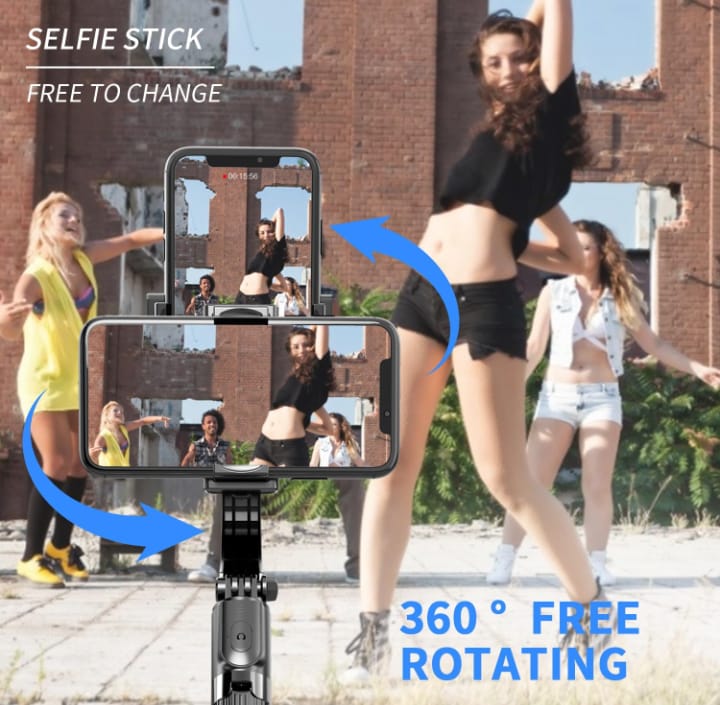 Person using a selfie stick with multiple screens showing different angles outdoors.