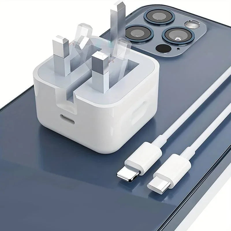 White charging adapter and cables on a reflective surface