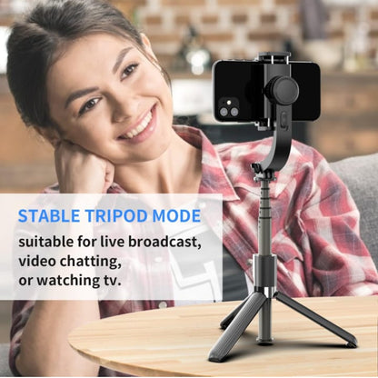 Person using a smartphone with a tripod attachment, suitable for live broadcast or video chatting.